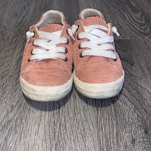 Dusty pink slip on sneakers.